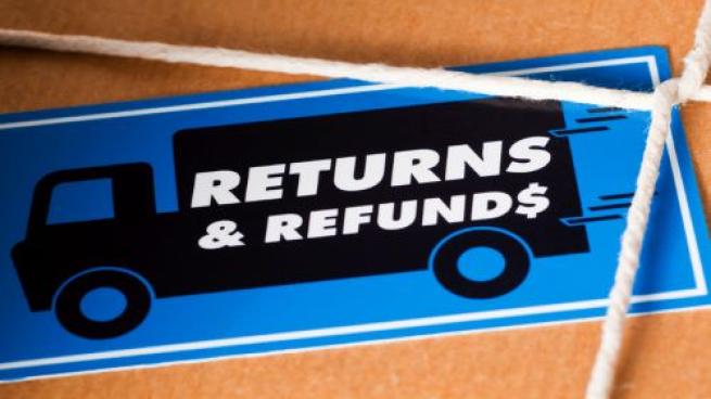 Returns and refunds sticker on cardboard box